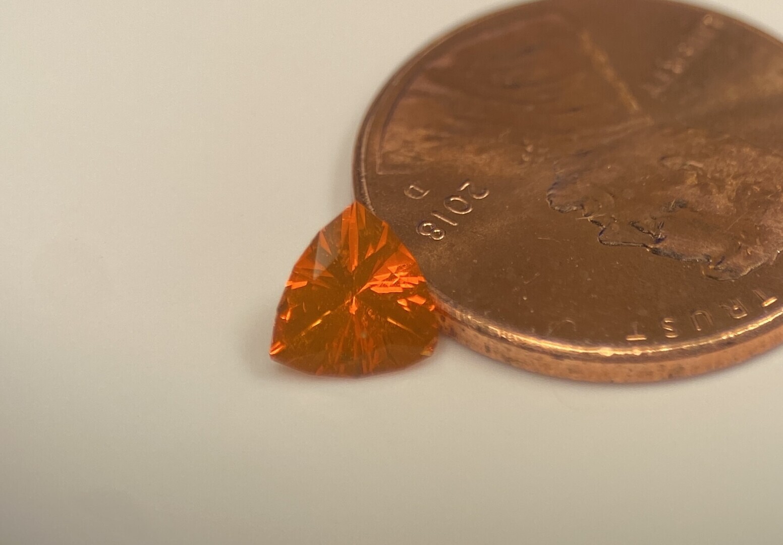 tiny orange triangle about three times the height of a penny