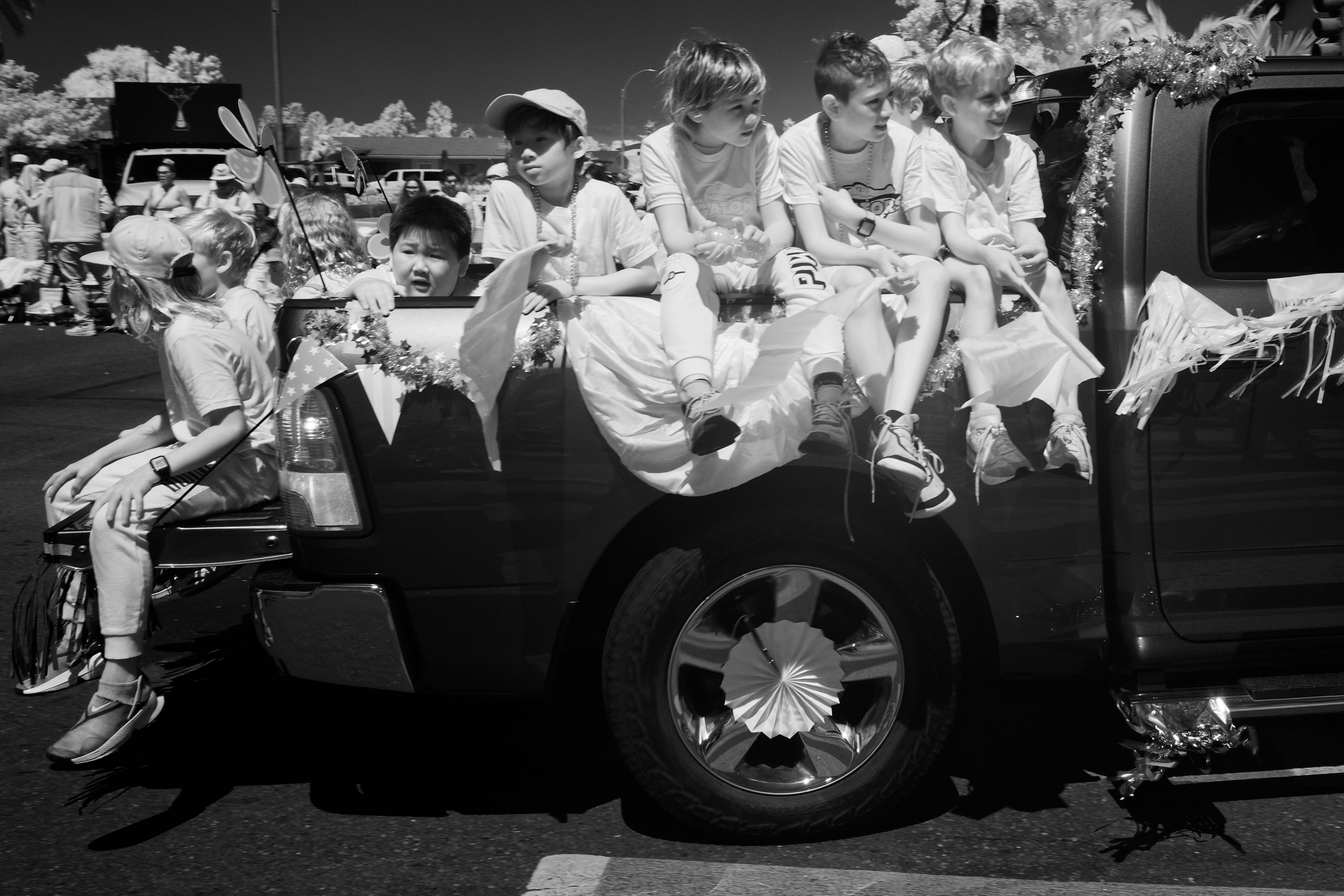 Kids piled into the back of a truck