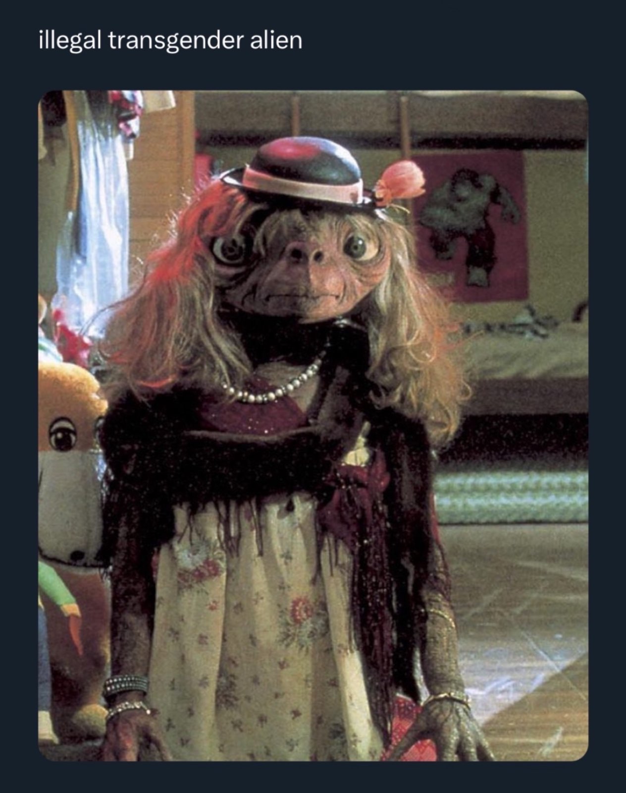 A screenshot of ET from the movie (1982) dressed as a girl