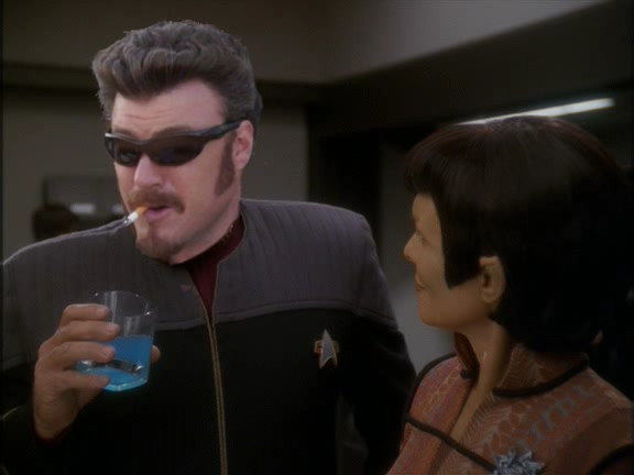 Admiral Ricky with a Romulane ale doing cowboy diplomacy